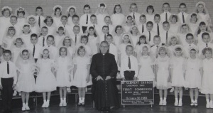 St. Clements First Communion 1964. Bryan Monte, second row to the right of the priest, Jerome Caja, second last row, fourth from the right side.